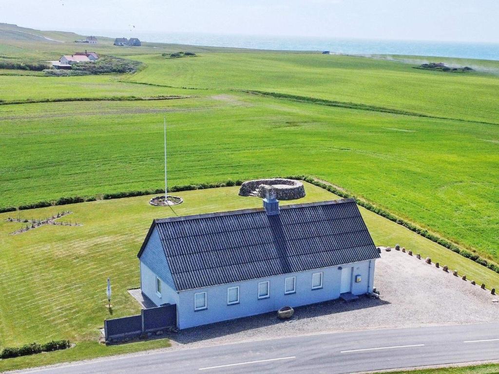 an overhead view of a blue building in a field at Holiday home Lemvig XXX in Lemvig