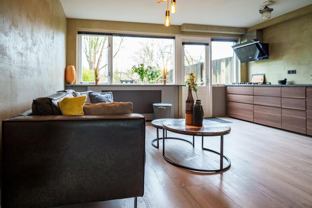 a living room with a couch and a table at City Design Studio in Alkmaar