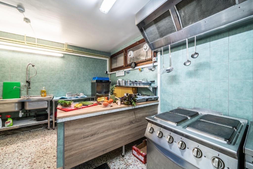 a kitchen with a sink and a stove in it at Coeur de Charmy - 10 personnes in Abondance