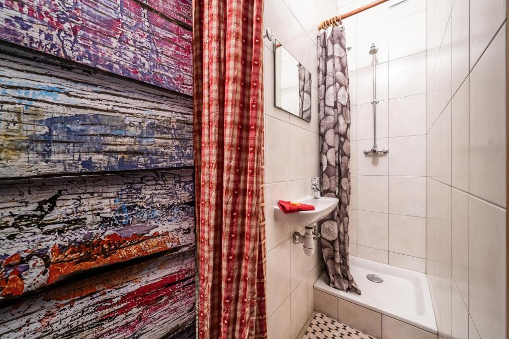 a bathroom with a shower curtain and a sink at Coeur de Charmy - 10 personnes in Abondance