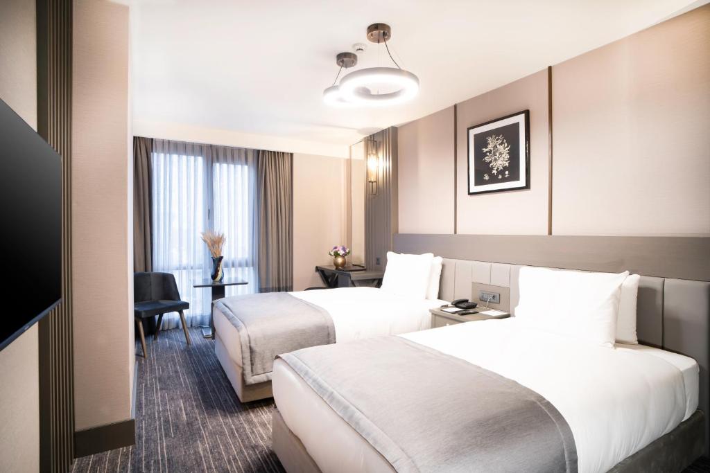 Arts Hotel Taksim客房内的一张或多张床位