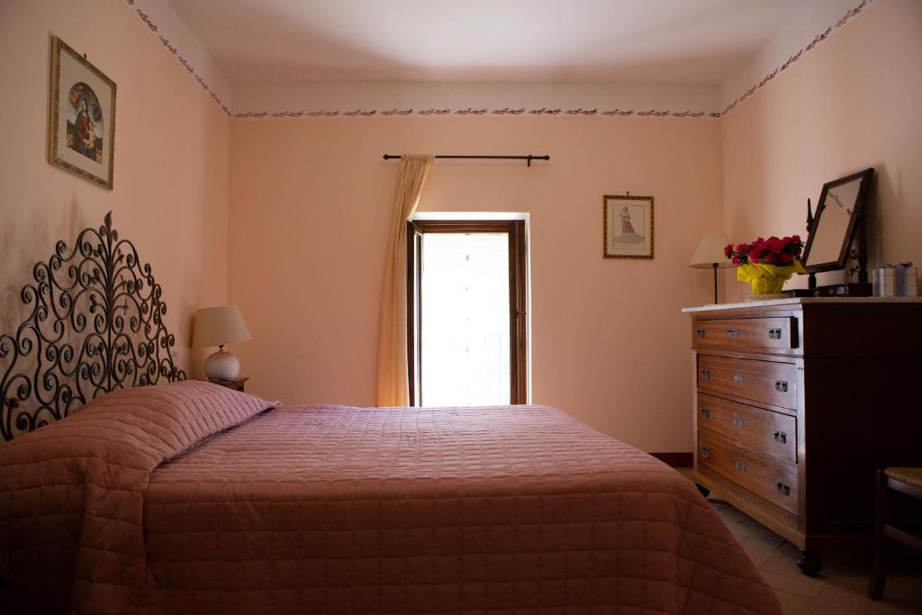 Postel nebo postele na pokoji v ubytování Agriturismo I Melograni