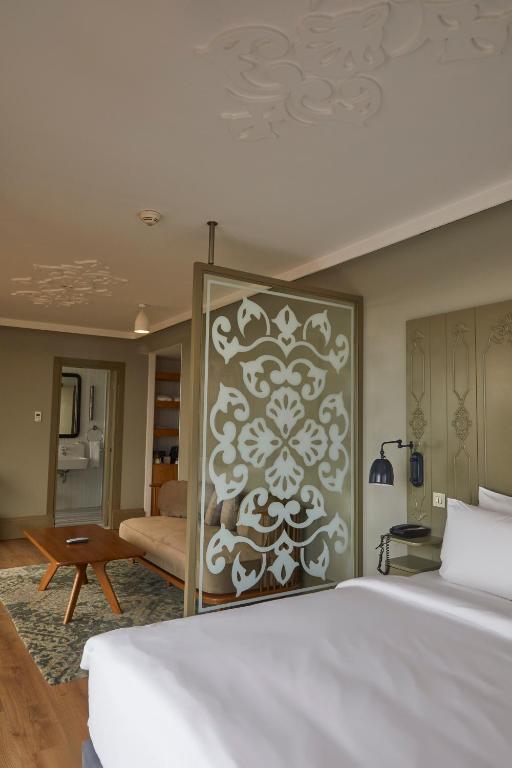 A bed or beds in a room at The Cettia Istanbul