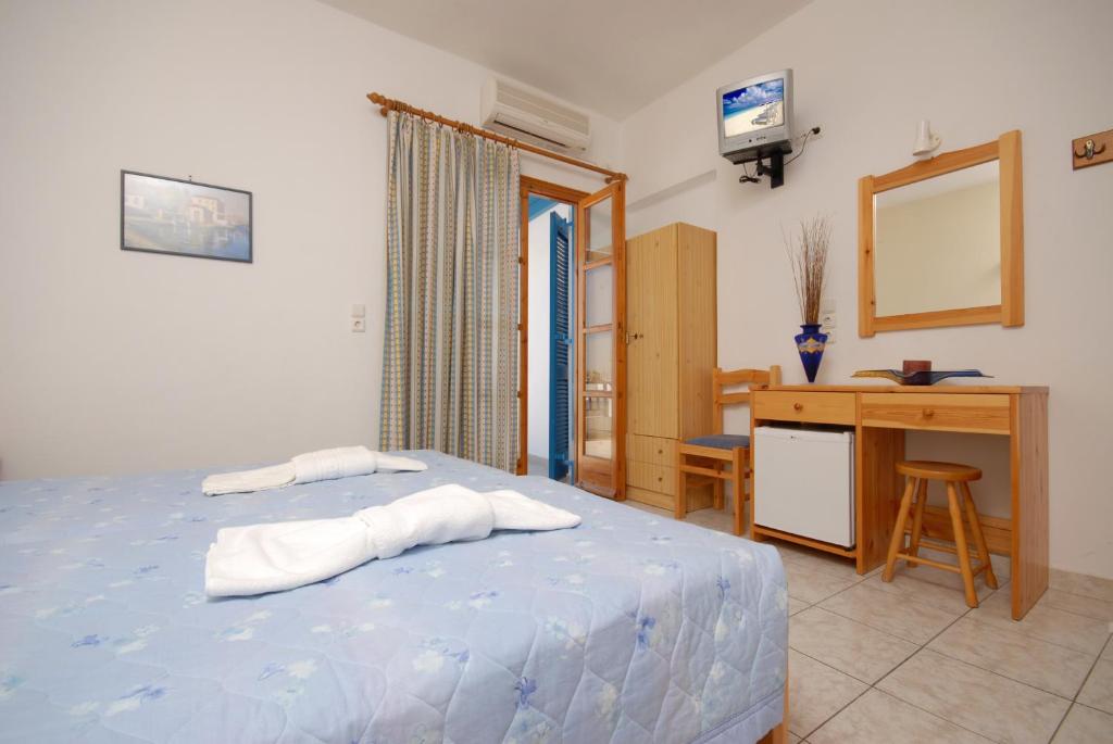 Postel nebo postele na pokoji v ubytování Hotel Zeus