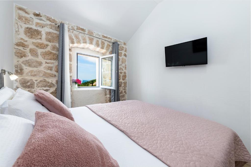 Postel nebo postele na pokoji v ubytování Villa Royal House