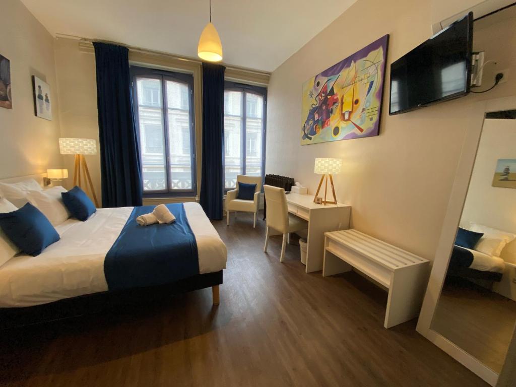 Postel nebo postele na pokoji v ubytování Hotel de Paris