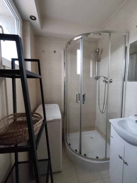 a bathroom with a shower and a toilet and a sink at Fat Kaz Apartment in Wrocław