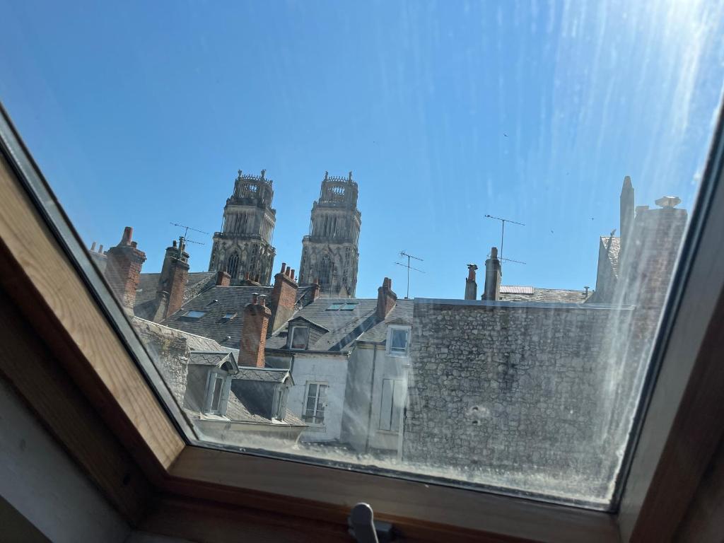 a view of a city from a window at les Pastoureaux in Orléans