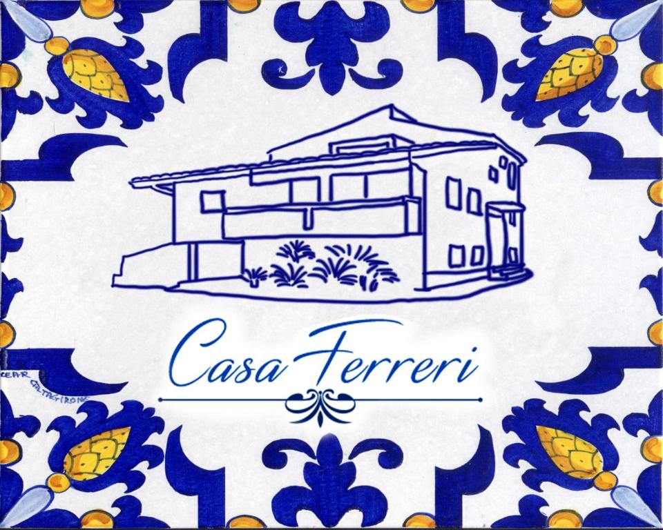 a drawing of a house on a blue and white plate at Casa Ferreri in Santa Ninfa