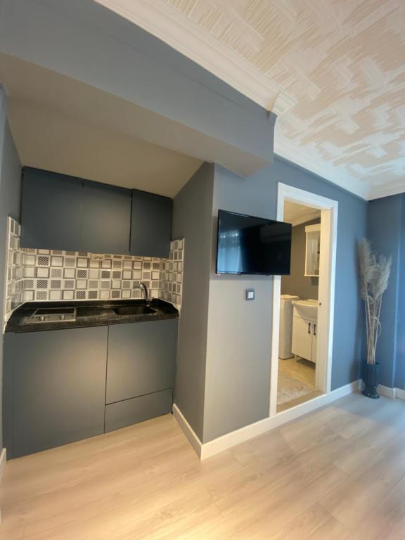 Kuchyň nebo kuchyňský kout v ubytování CLK Suites Hotel