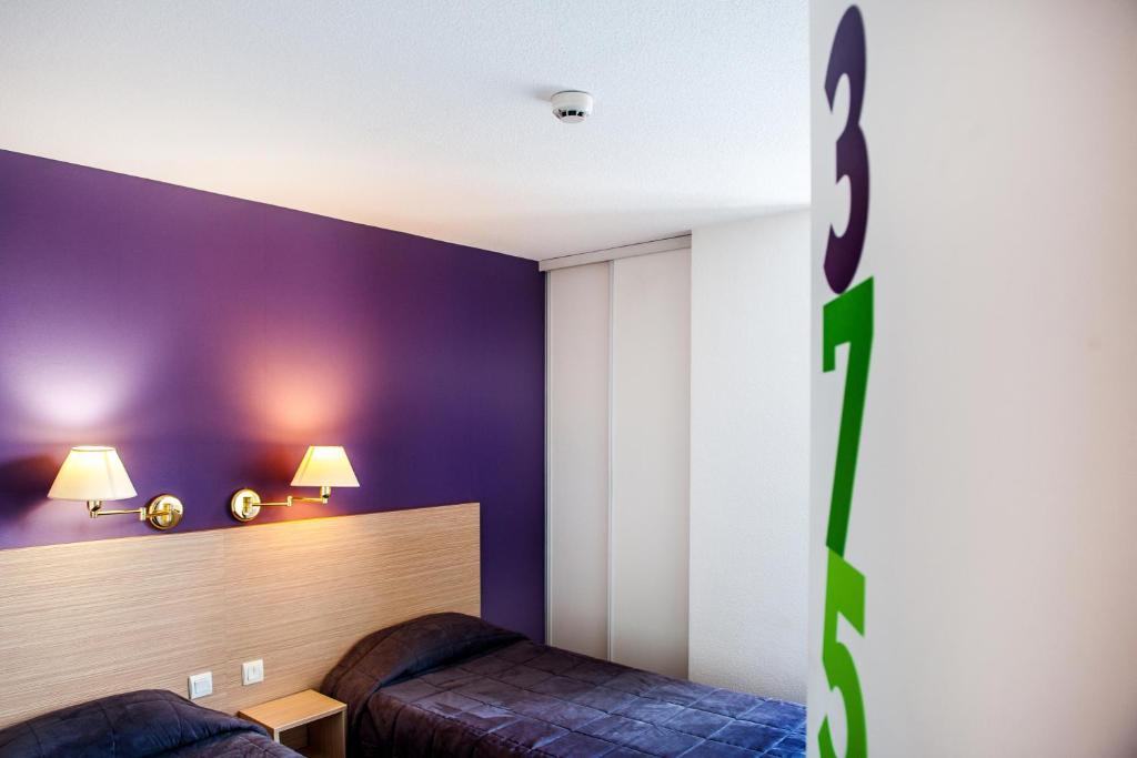 Postel nebo postele na pokoji v ubytování Hôtel Continental