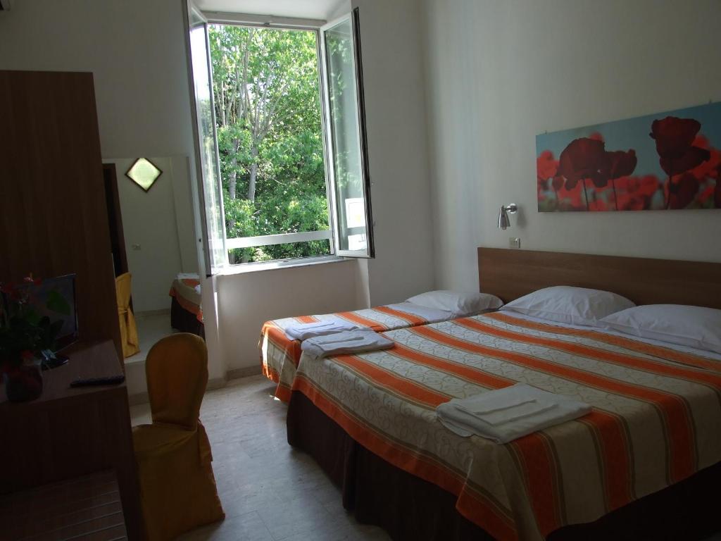 Postel nebo postele na pokoji v ubytování Hotel Derna