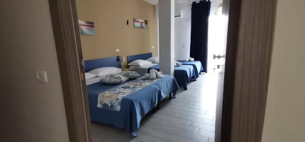 Postel nebo postele na pokoji v ubytování Giostemar Rooms - Playa Grande