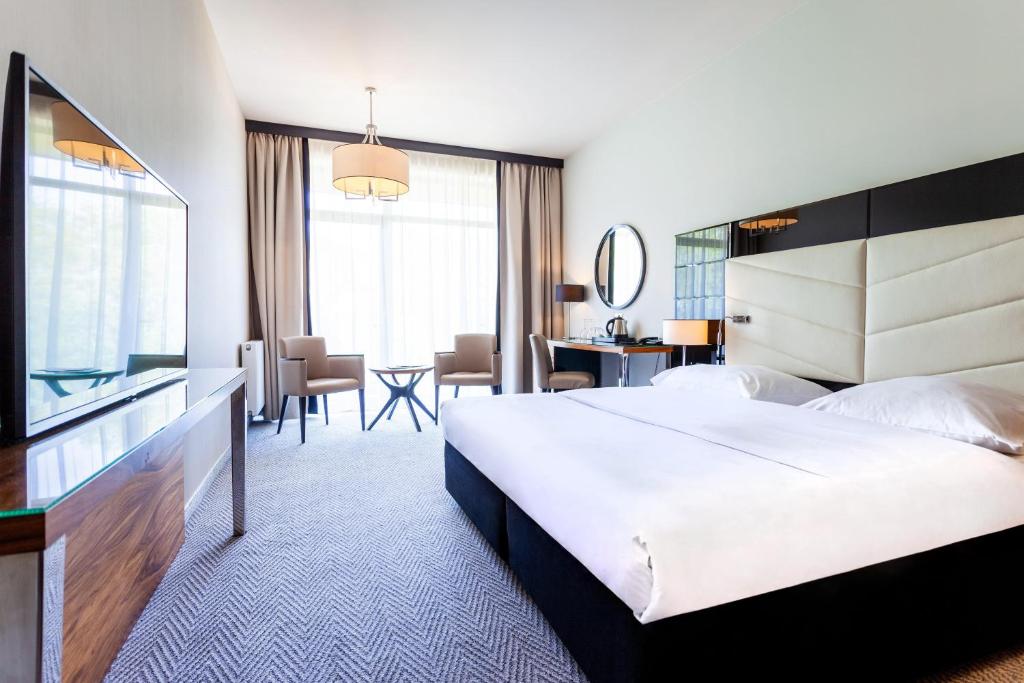 Postel nebo postele na pokoji v ubytování Diune Hotel by Zdrojowa