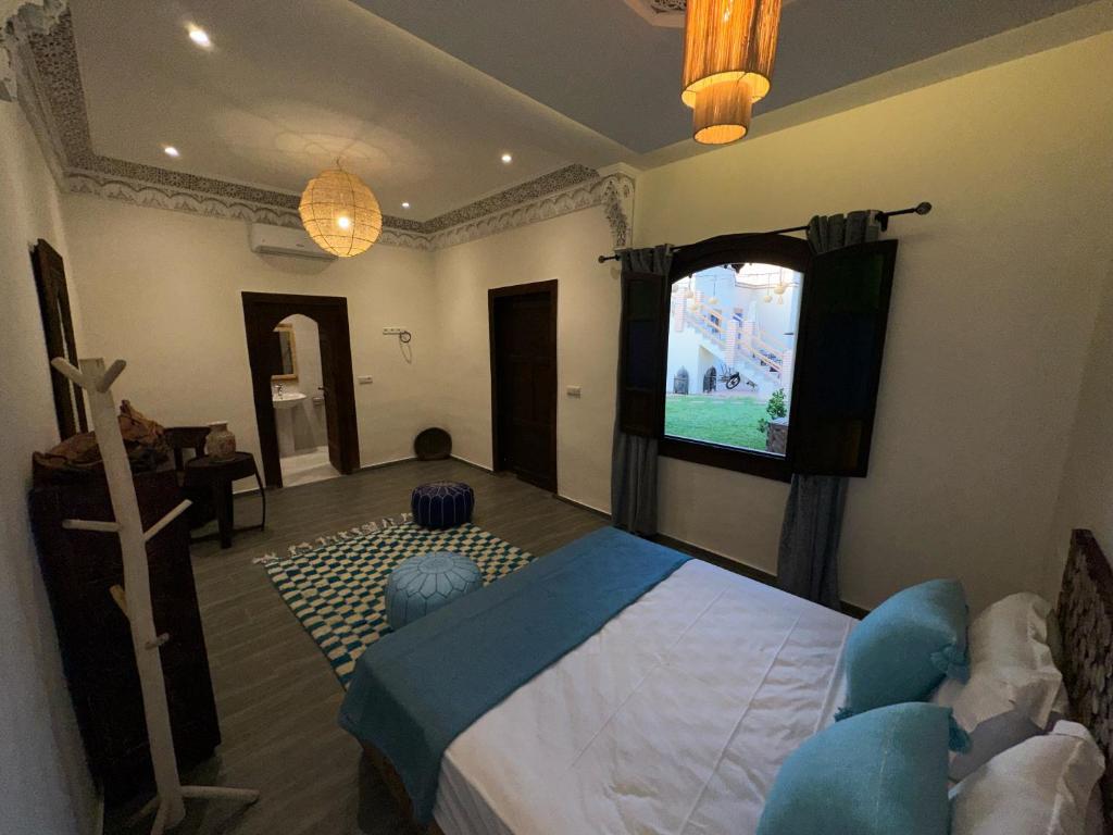 Postel nebo postele na pokoji v ubytování Oasis Merasi Marrakech