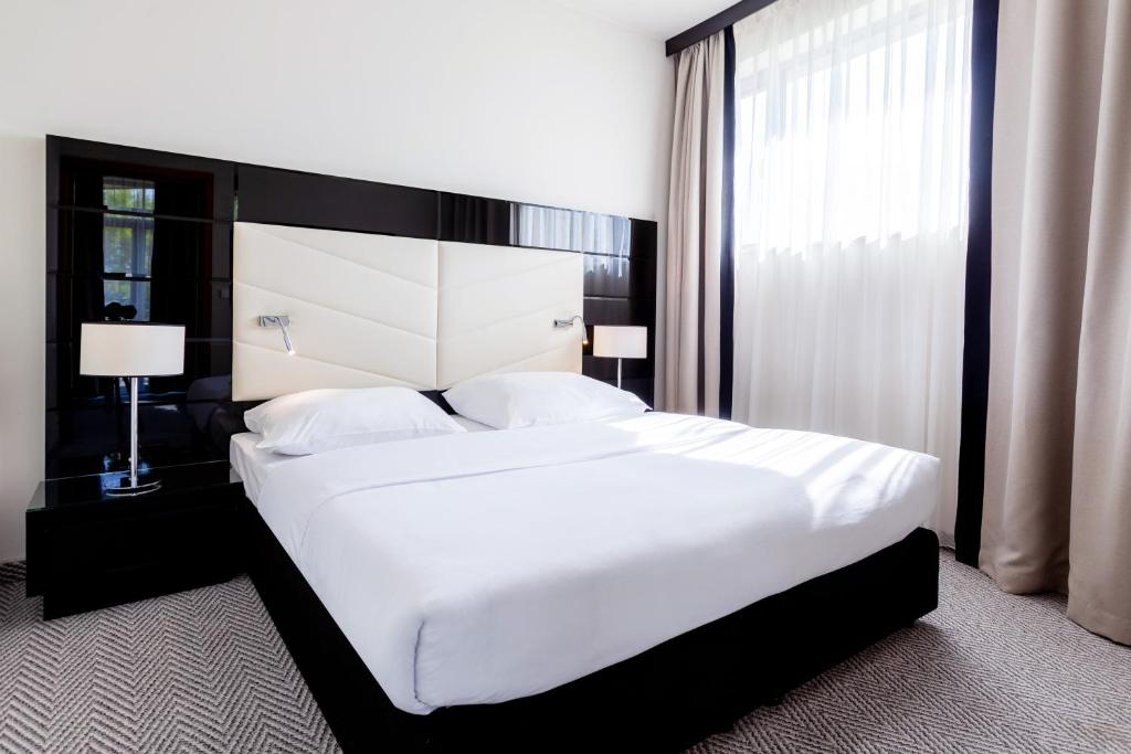 Postel nebo postele na pokoji v ubytování Diune Hotel by Zdrojowa