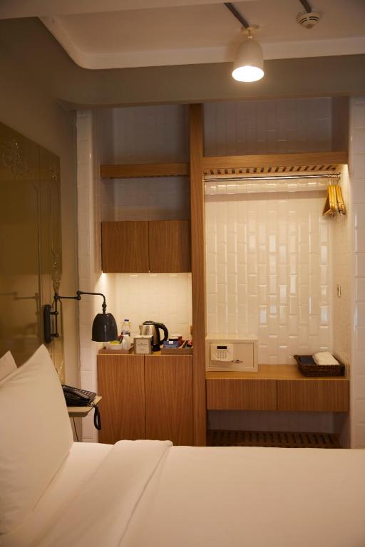 A bed or beds in a room at The Cettia Istanbul