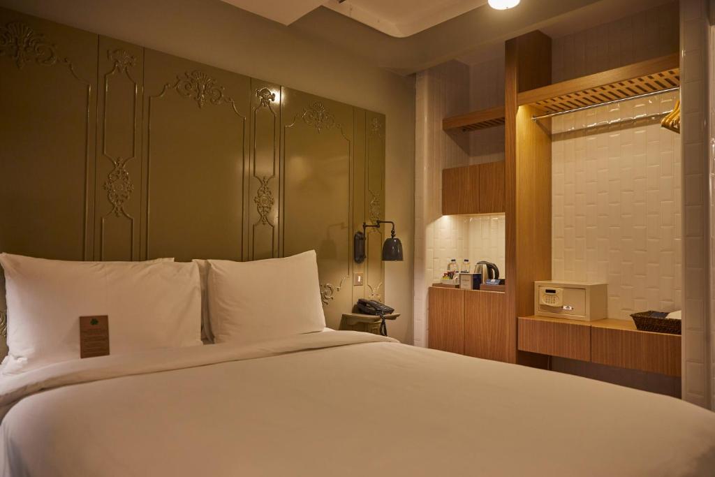 A bed or beds in a room at The Cettia Istanbul