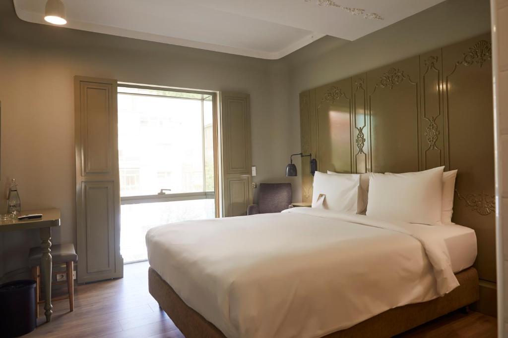 A bed or beds in a room at The Cettia Istanbul