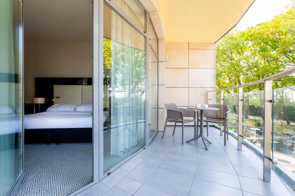 Postel nebo postele na pokoji v ubytování Diune Hotel by Zdrojowa