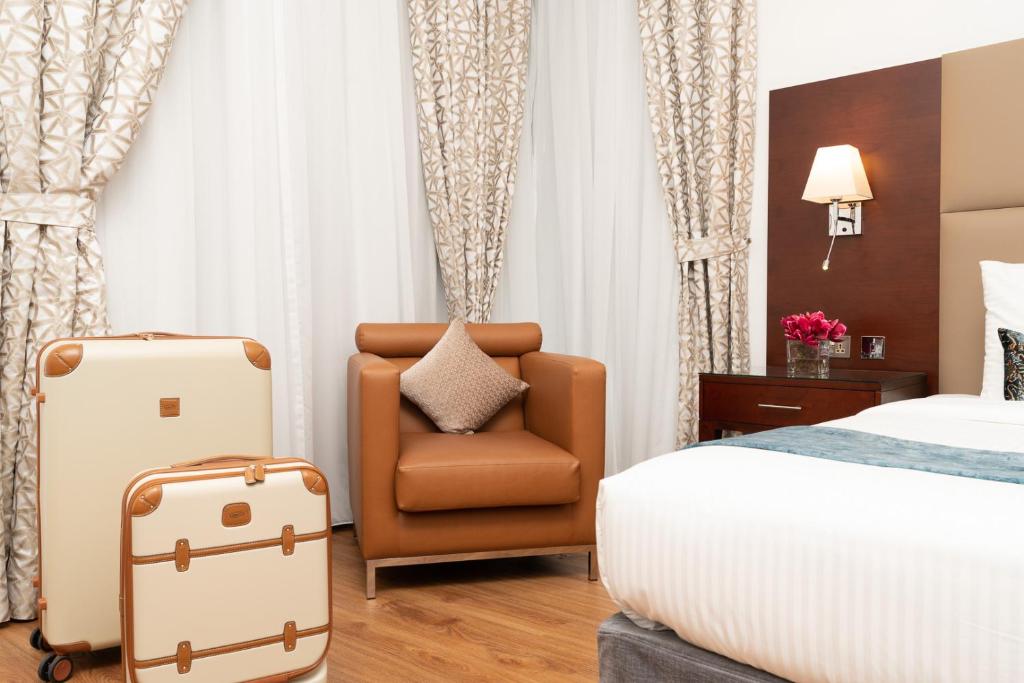 Postel nebo postele na pokoji v ubytování Golden Sands Hotel & Residences