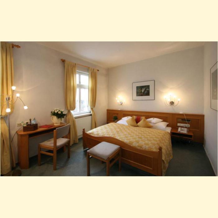 Postel nebo postele na pokoji v ubytování Hotel & Restaurant Grenzhof