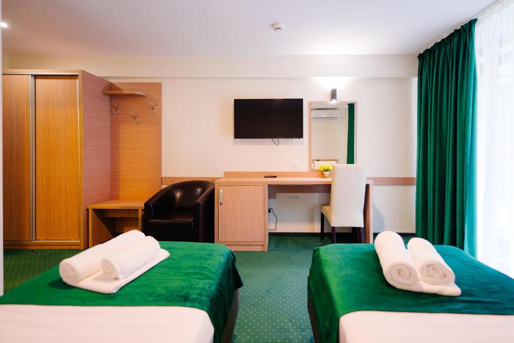 TV a/nebo společenská místnost v ubytování Hotel Parc