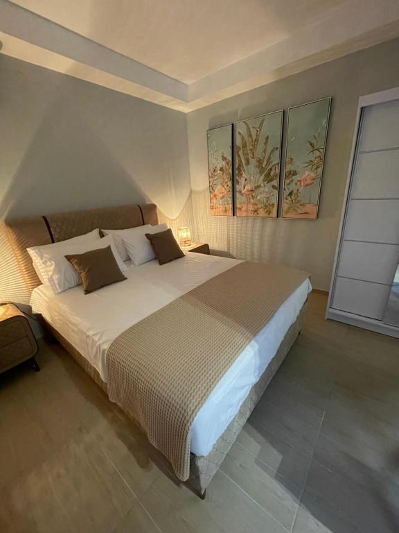 a bedroom with a large bed in a room at Barbara’s House,New Superior Central Studio in Nea Kallikrateia