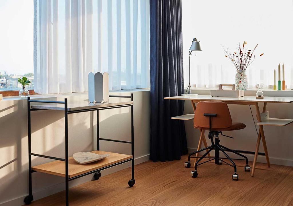 a room with a desk and a chair and a table at Charlottehaven in Copenhagen