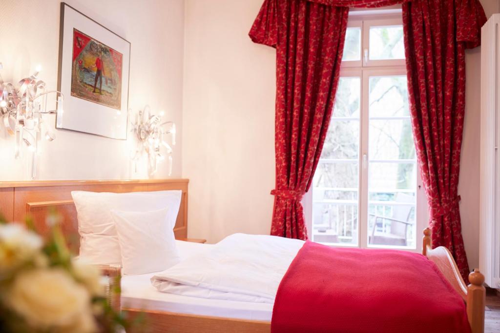 Postel nebo postele na pokoji v ubytování Hotel & Restaurant Grenzhof