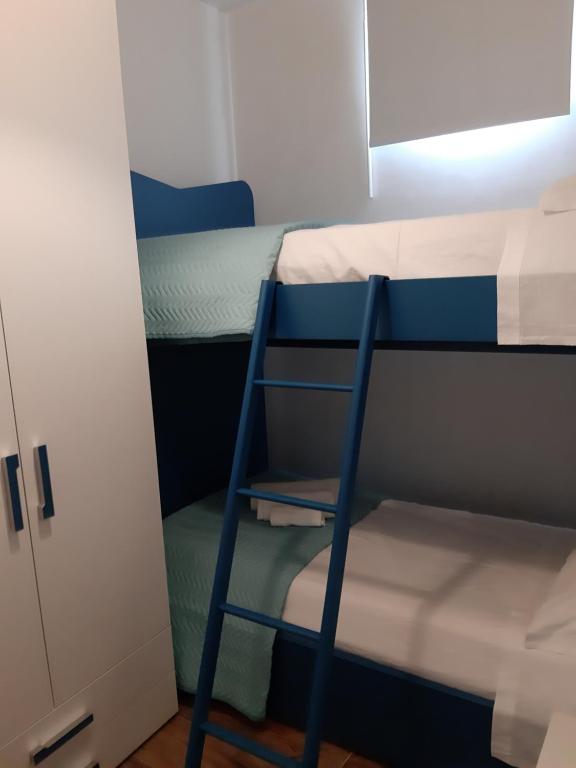 Postel nebo postele na pokoji v ubytování Cuocciu ri zuccuru