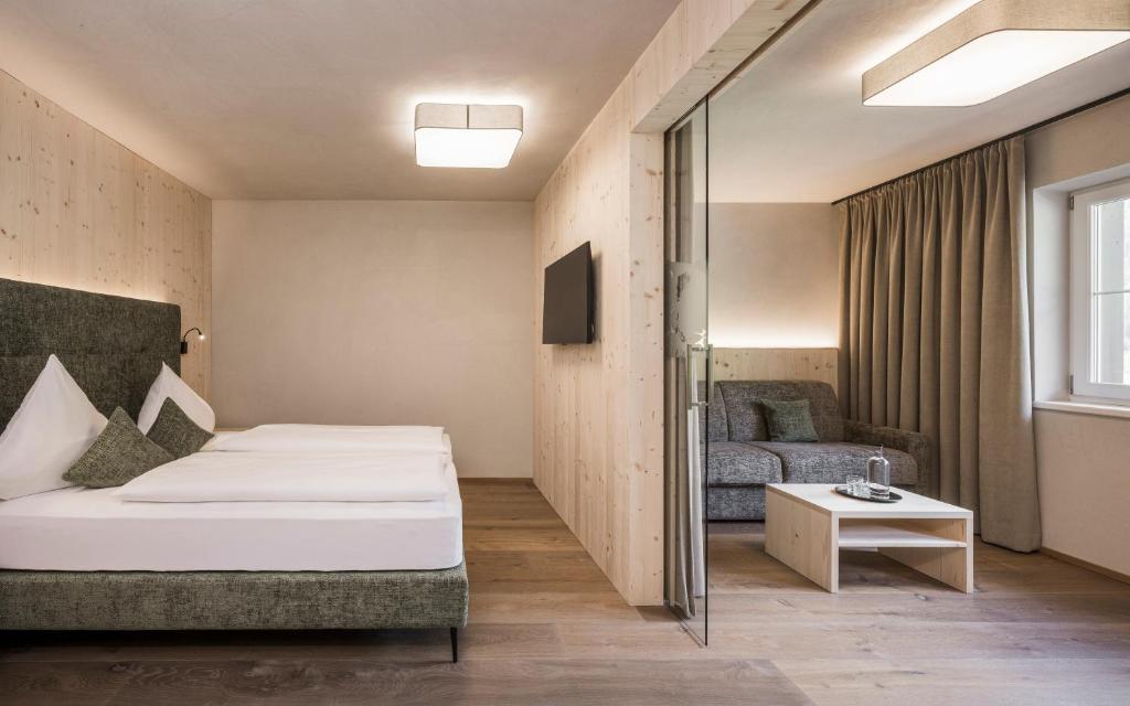 Łóżko lub łóżka w pokoju w obiekcie Vital Hotel Ortlerspitz
