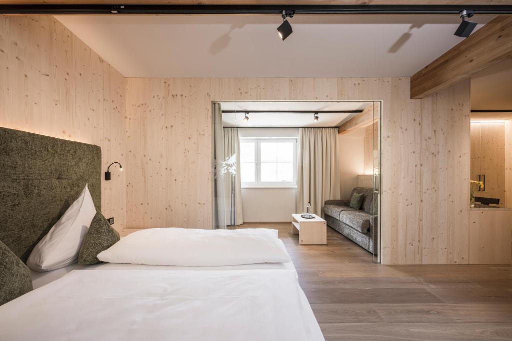 Łóżko lub łóżka w pokoju w obiekcie Vital Hotel Ortlerspitz