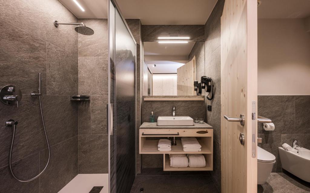 a bathroom with a shower and a sink at Vital Hotel Ortlerspitz in San Valentino alla Muta