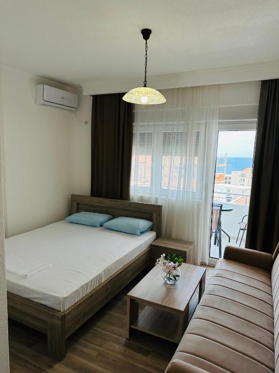 Postel nebo postele na pokoji v ubytování Apartmani Sunce