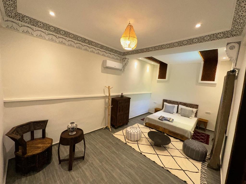 Postel nebo postele na pokoji v ubytování Oasis Merasi Marrakech