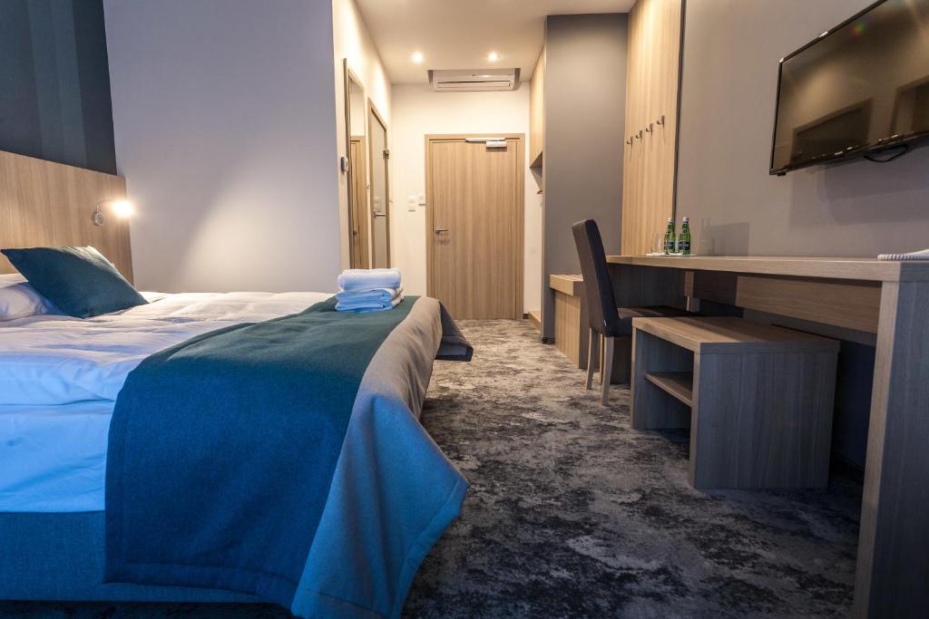 Postel nebo postele na pokoji v ubytování Hotel Zatoka