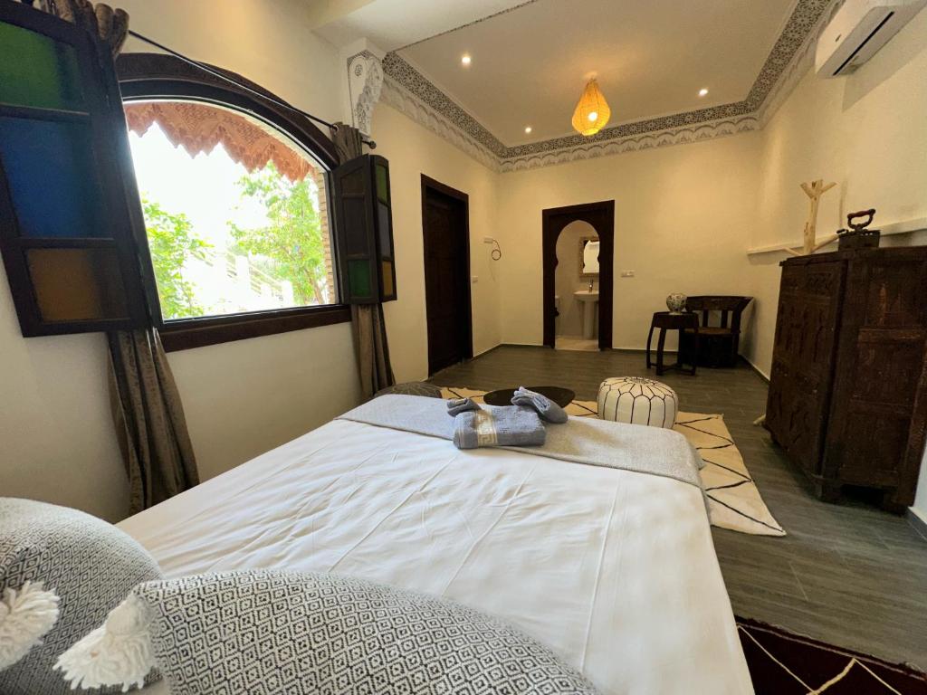 Postel nebo postele na pokoji v ubytování Oasis Merasi Marrakech