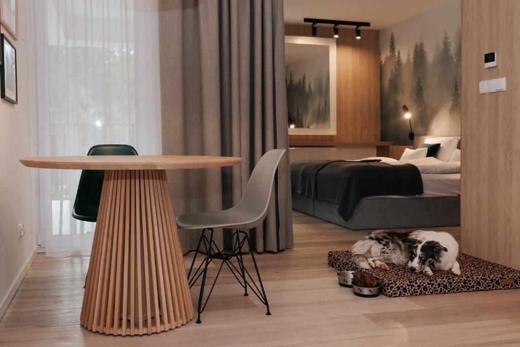 Postel nebo postele na pokoji v ubytování VISLOW Resort