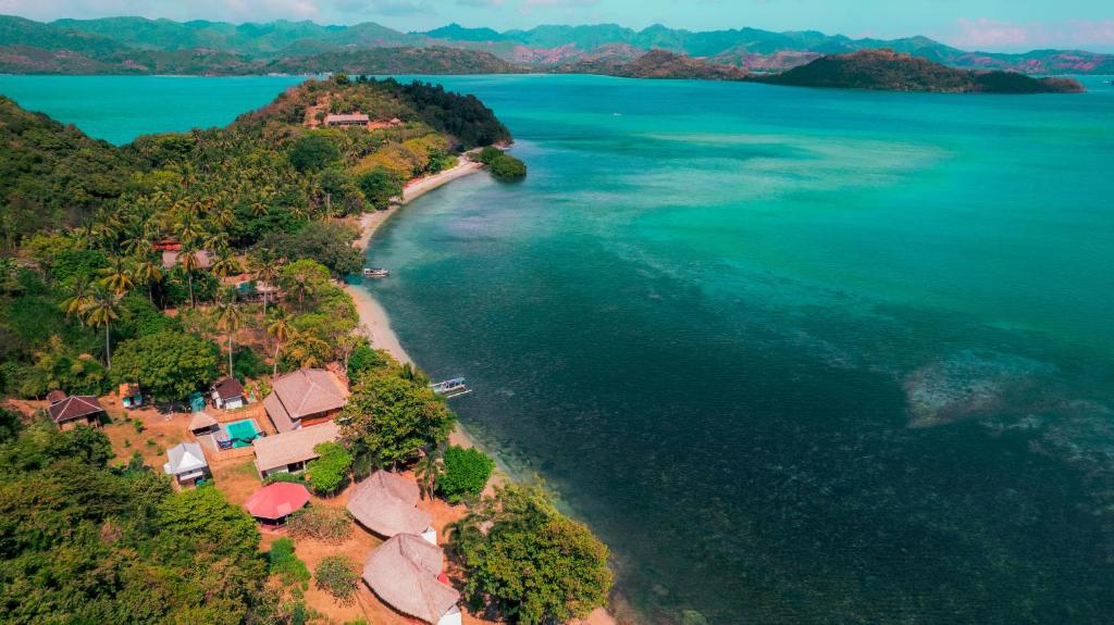 an aerial view of an island with houses and the ocean at Khabita Beach Resort in Lembar