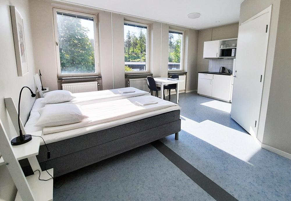 Tempat tidur dalam kamar di Sidsjö Hotell & Konferens