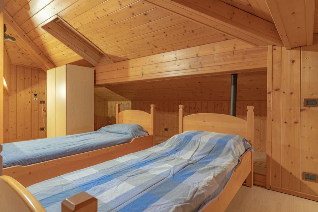 Postel nebo postele na pokoji v ubytování Casa ai Tre Colli, Tres