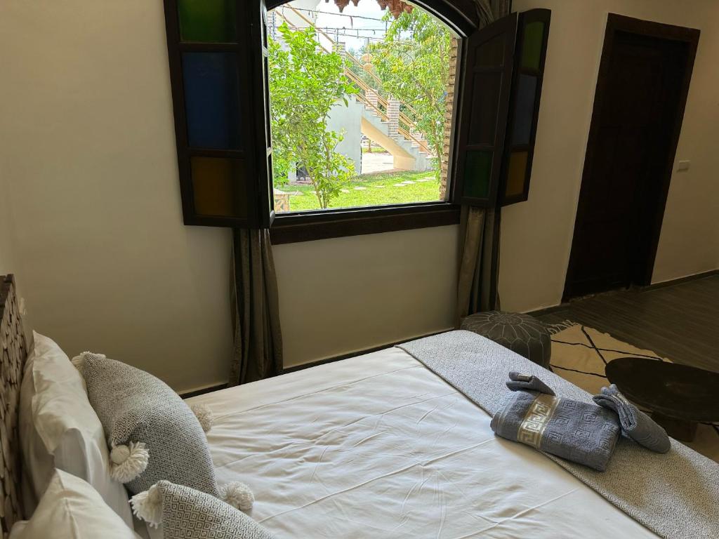 Postel nebo postele na pokoji v ubytování Oasis Merasi Marrakech