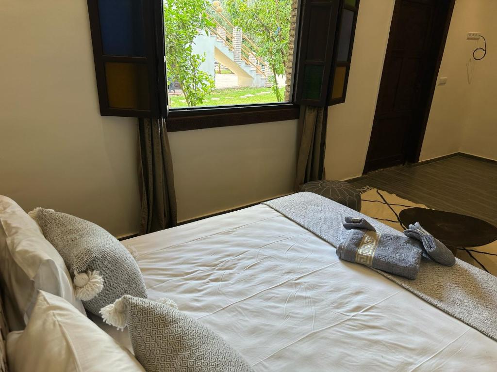 Postel nebo postele na pokoji v ubytování Oasis Merasi Marrakech