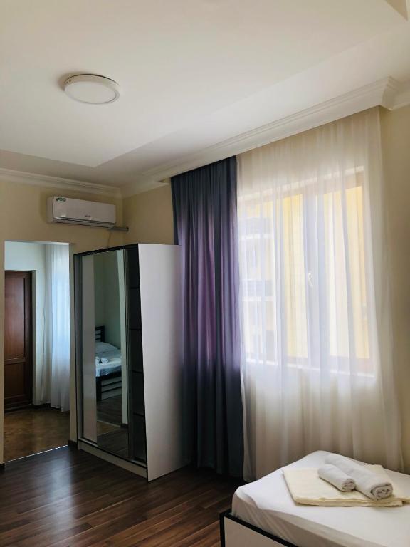 Postel nebo postele na pokoji v ubytování KISI Hotel
