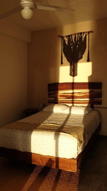 Postel nebo postele na pokoji v ubytování Tropic Bacalar