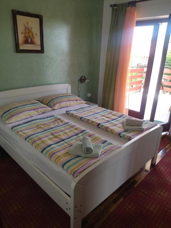 Postel nebo postele na pokoji v ubytování Zelena oaza Apartment