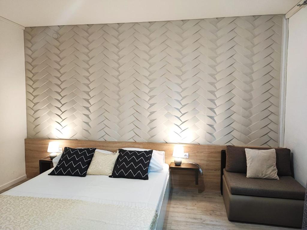Postel nebo postele na pokoji v ubytování Apartments Gavran 2.