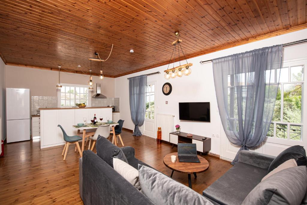 a living room with a couch and a table at Perispit in Lefkada