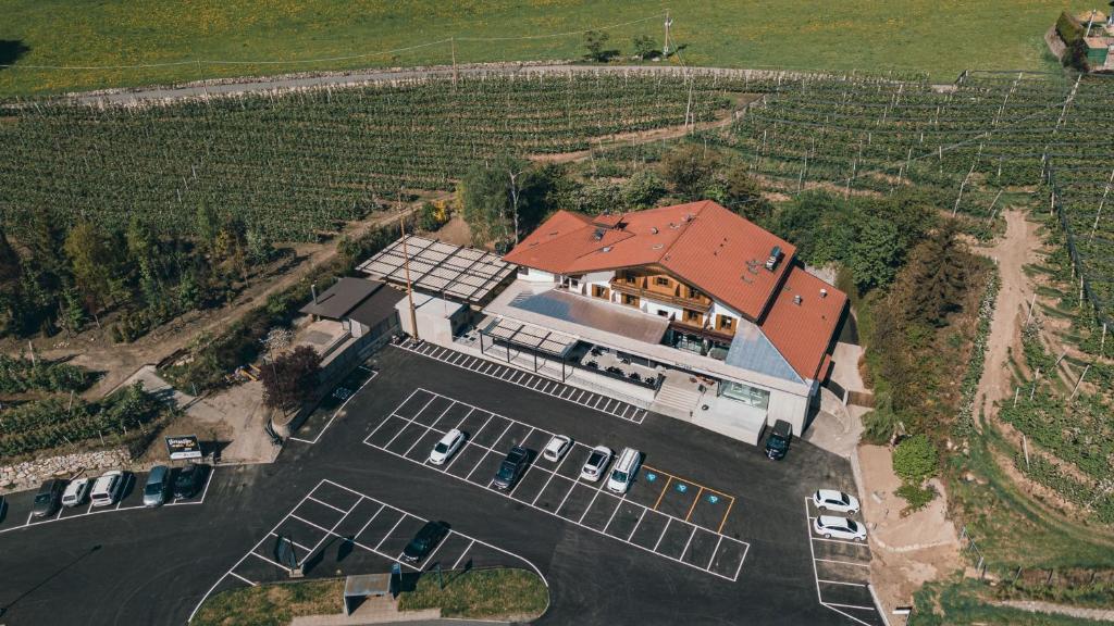 an aerial view of a house with solar panels on it at Hotel Restaurant Putzer in Naz-Sciaves
